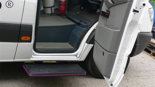 AutoCool Automatic Axial Door Kit — front pivoting door open on a white van with the step deployed